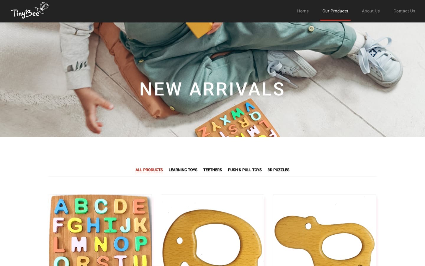Our Products page — 'New Arrivals' banner above a category filter (All Products, Learning Toys, Teethers, Push & Pull Toys, 3D Puzzles) and the product grid